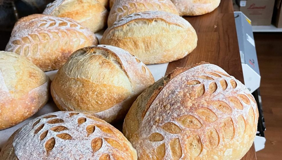 Loaves of sourdough bread on counter at Good Girls Bakery.