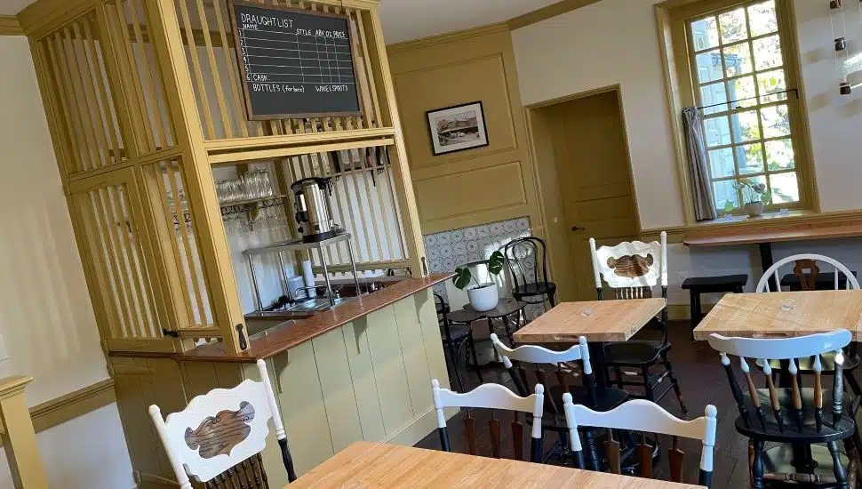 A Man Full of Trouble dining area with chairs and cream details.
