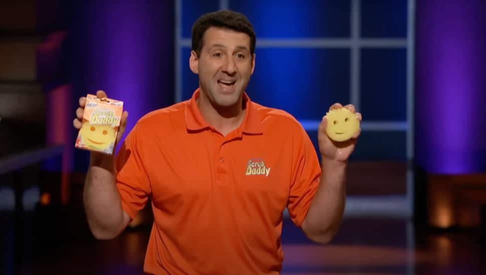 Aaron Krause holding Scrub Daddy sponges on Shark Tank.