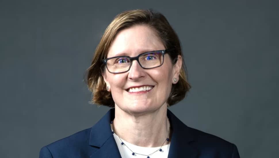 Anna Paulson wearing glasses headshot.