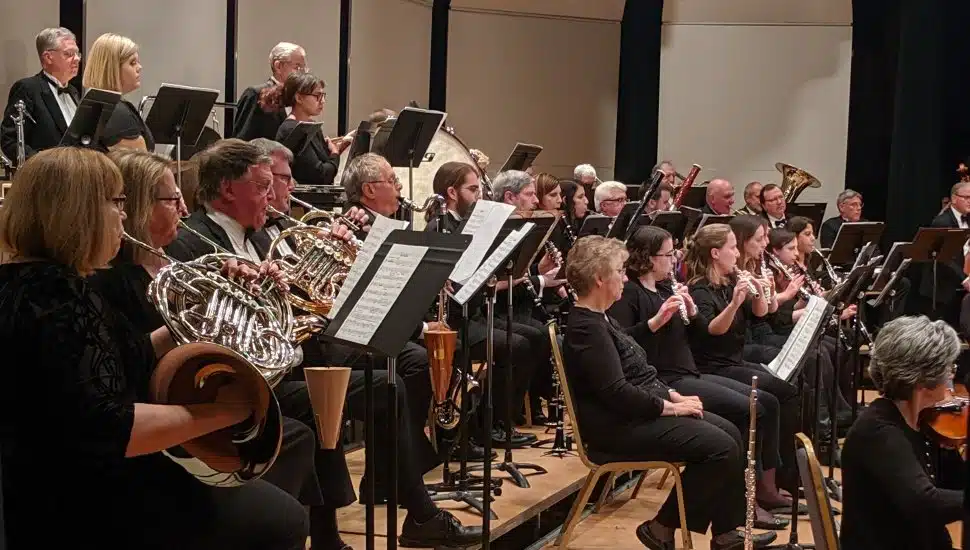 A Clarinet Choir plays at Immaculata University. The band of musicians is full and reading sheet music.
