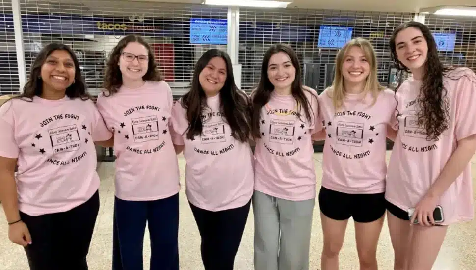 Group of female students in pink shirts for Cam-A-Thon.