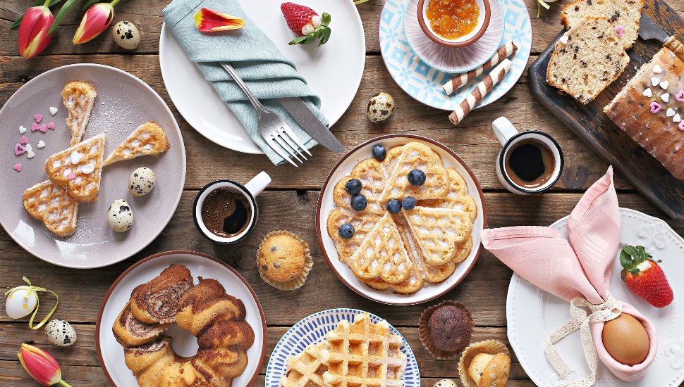 Plates of food and pastries for Easter brunch.