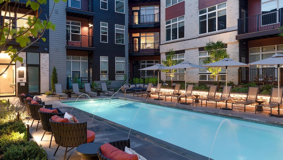 Apartment corner at the pool with lounge chairs at The Point at Berwyn.