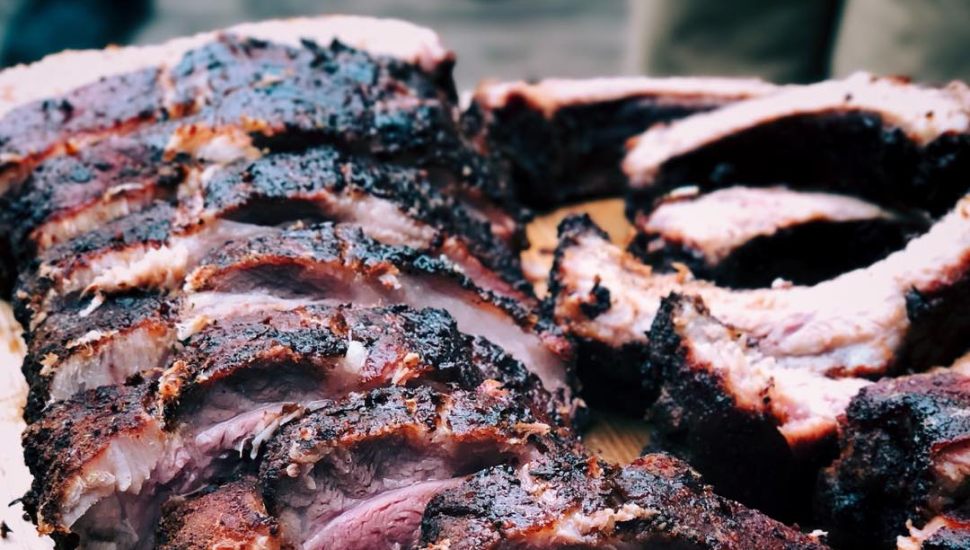 Smoked brisket mean on a cutting board.