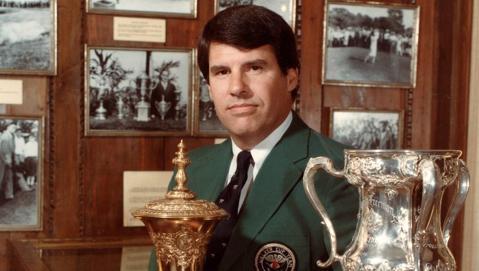 Young Jay Sigel in a green suit with a trophy.