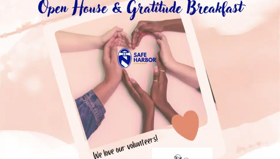 A Safe Harbor poster showing hands on a table combining to make the shape of a heart.