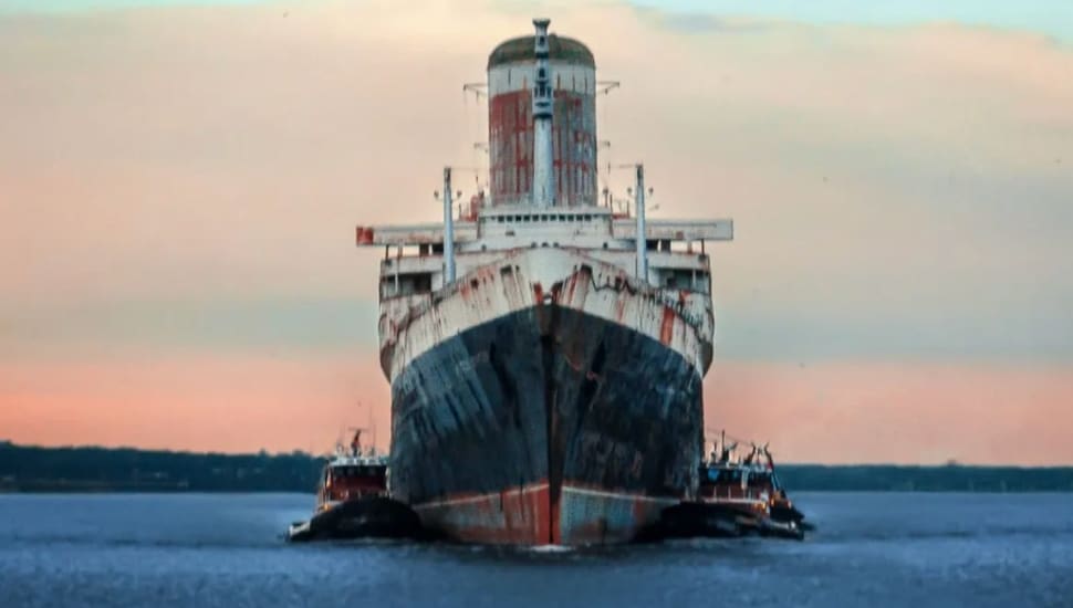 SS United States view from the front as it is pulled through the water.