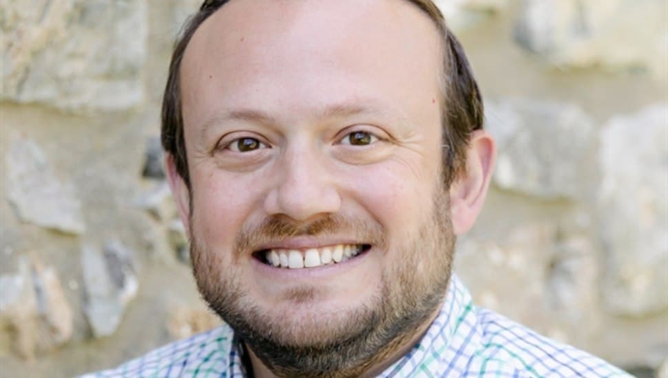 Scott Overland smiling for headshot.