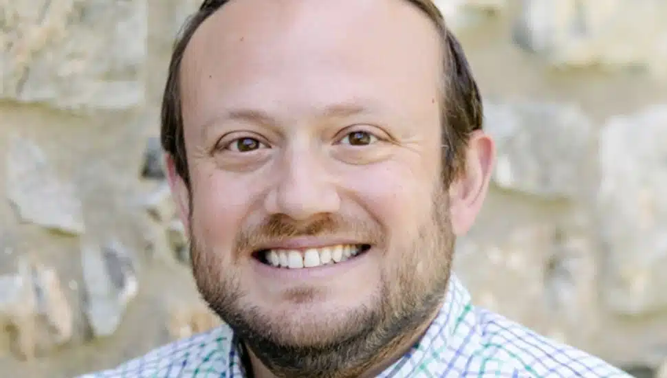 Scott Overland smiling for headshot.