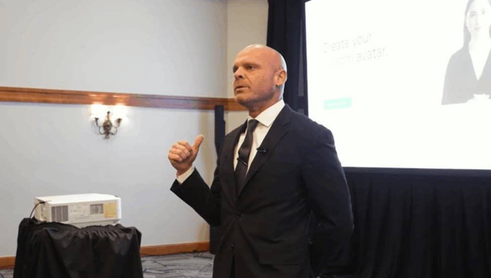 Tony Giordano, one of the world’s top Real Estate Influencers, delivered a masterclass on leveraging AI and digital tools at the Collaborative Real Estate Summit 2025. He stands at the front of the room and is pointing to the screen behind him.
