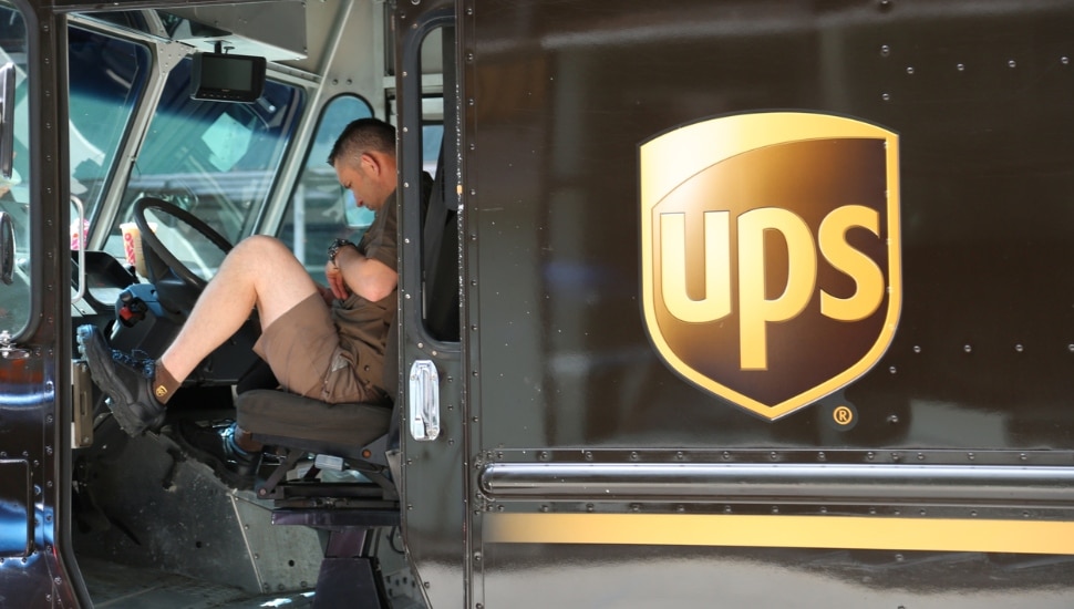 UPS driver sitting in his truck.