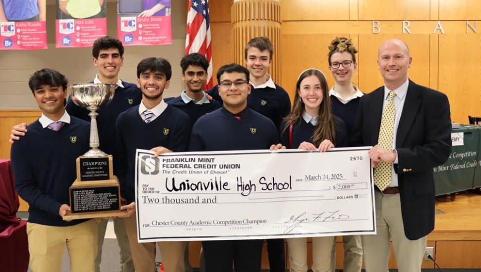 Unionville High School academic team together with big check.