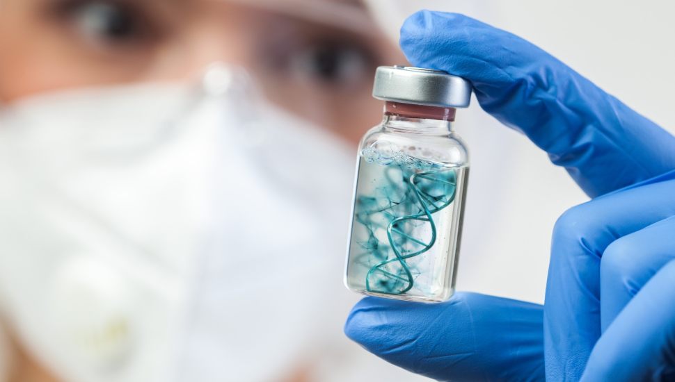 Lab person holding a vial with material instead.
