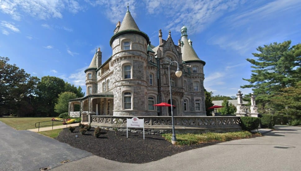Rosemont College main building with stone and castle-like structure.