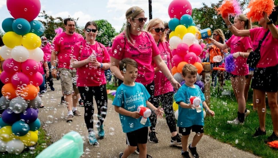 Jaclyn Urso-DeFeo and Family are showered with bubbles during the May 18 Arc Bubble Walk & Fun Day.