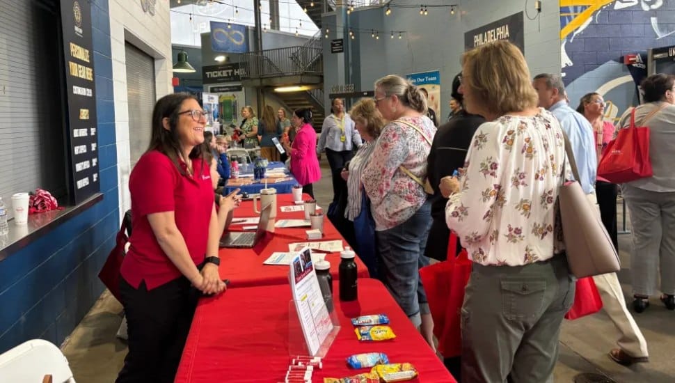 Crozer job fair with a bunch of people talking.