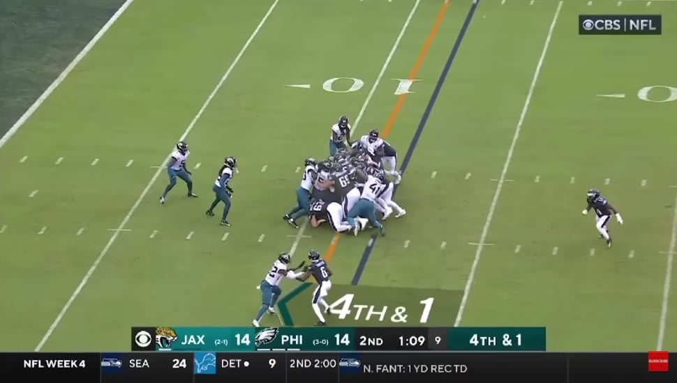 Eagles performing tush push during game.