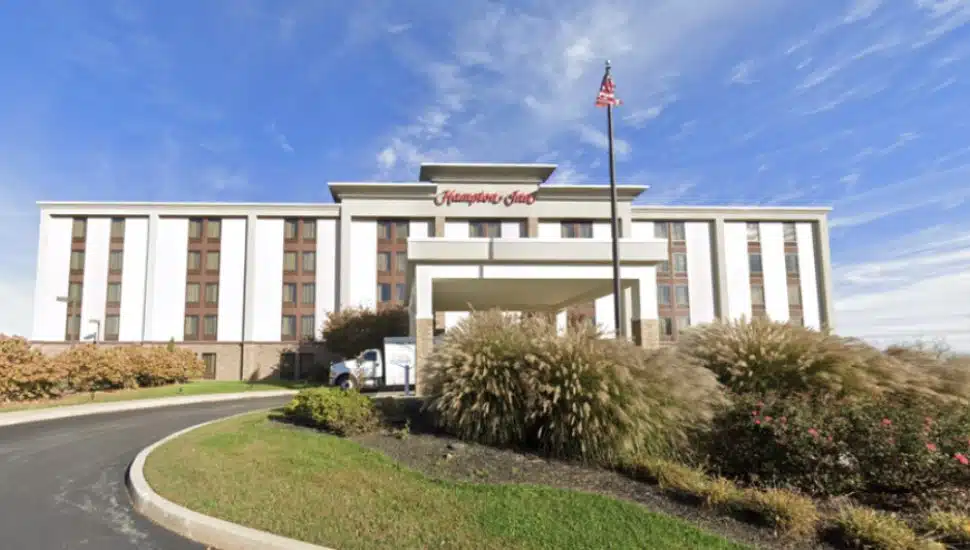Hampton Inn front view with blue sky in background.