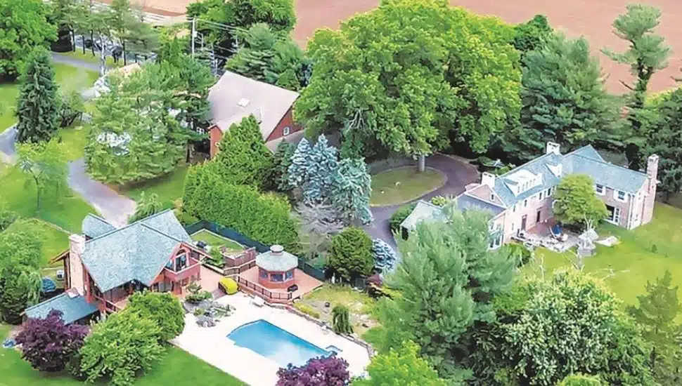 Hidden Trail Farm aerial view with house, pool, trees, and more.