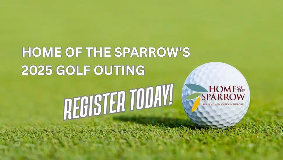A golf ball with the Home of the Sparrow logo.