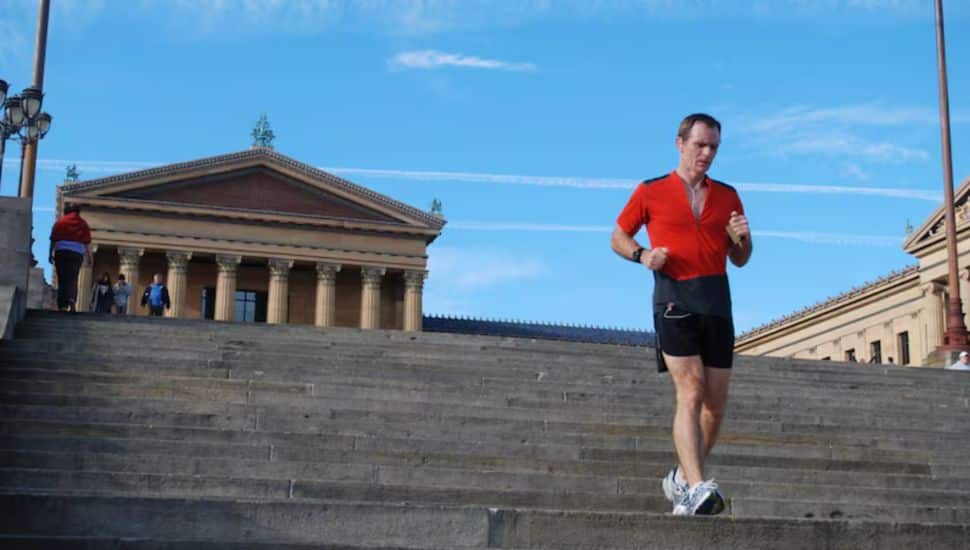 Mark Gibson runs down the steps at the Philadelphia Museum of Art.