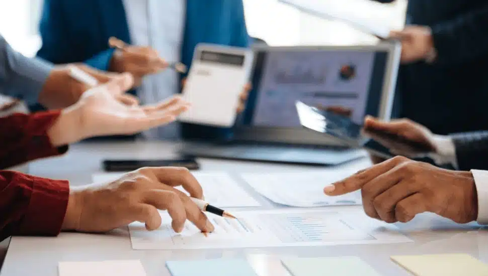 Business executives discuss a company's valuation.