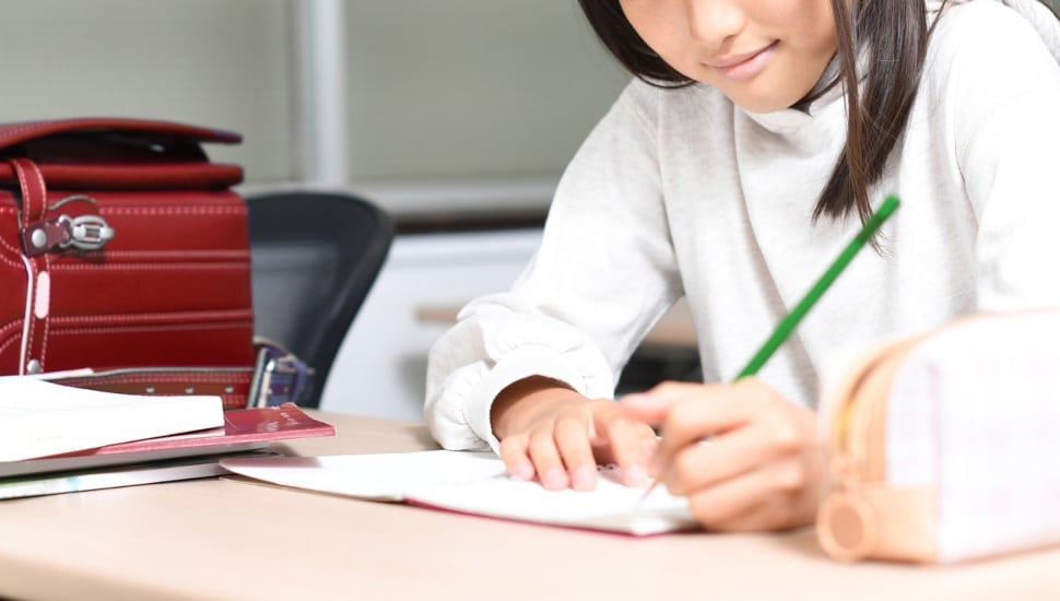 Student working at desk.