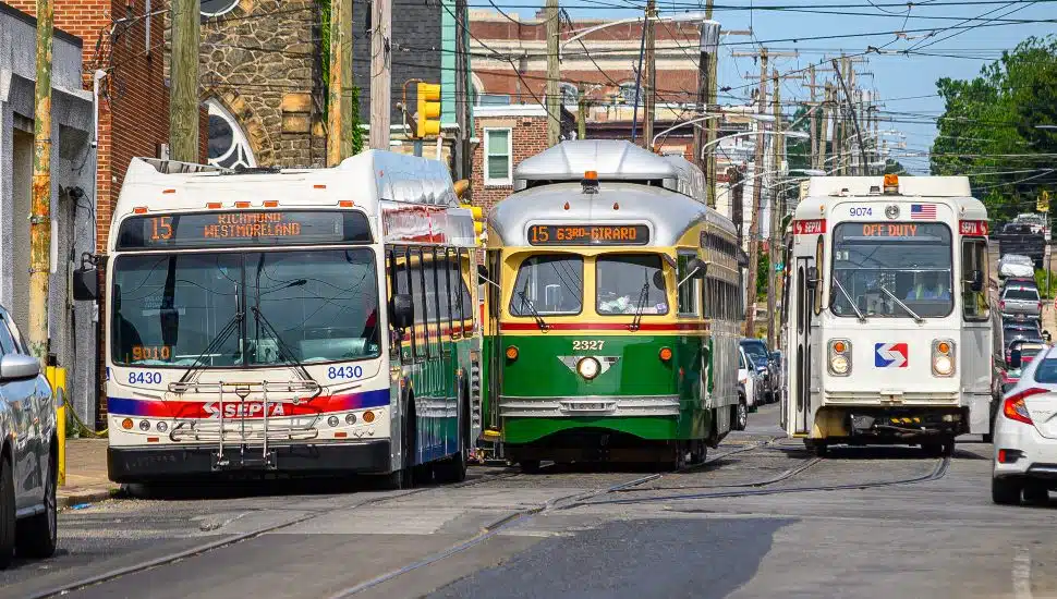Philadelphia Transit Scene at 63rd and Girard stock. SEPTA buses lined up on busy street.