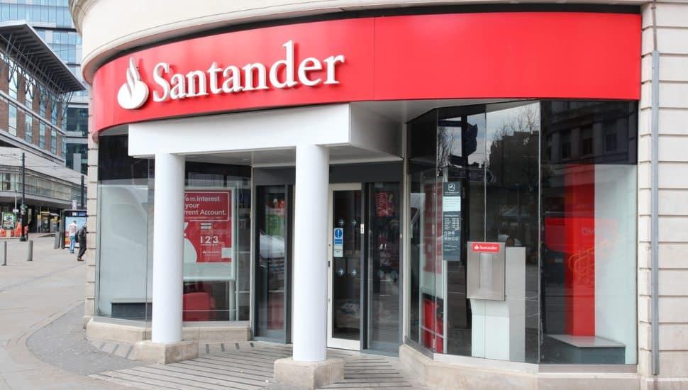Santander Bank entrance with red sign.