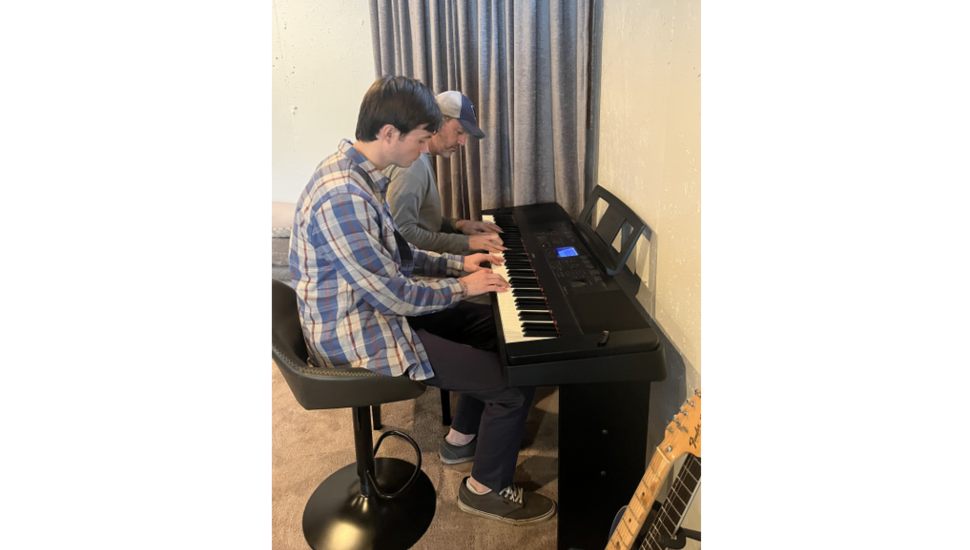 Will Kleman and dad on the piano.