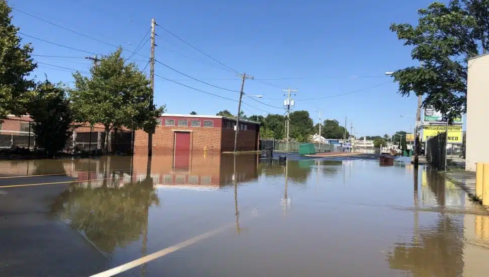 Flooding water on a town road.