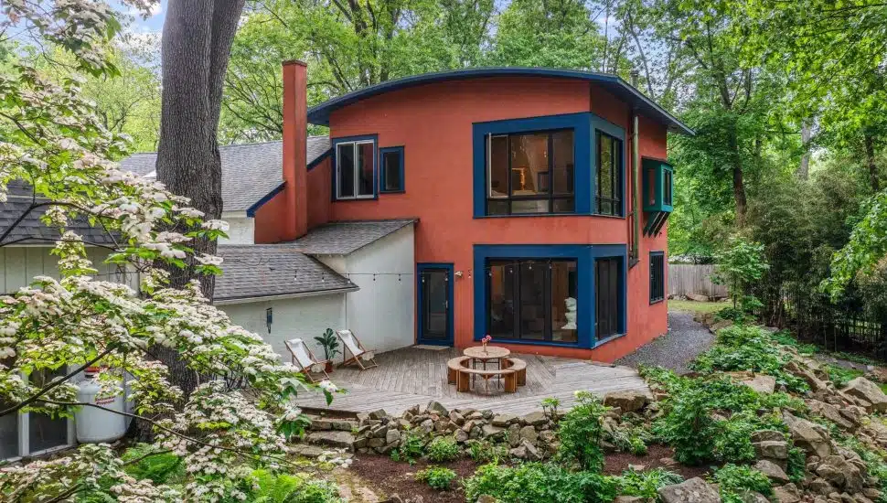 1420 Little Conestoga Road property with red home and nature surrounding.