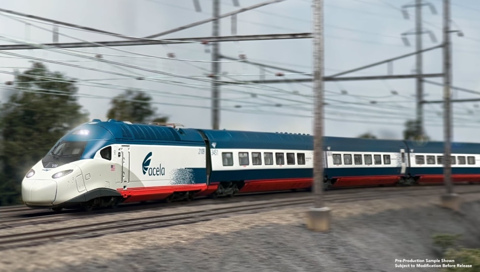 Acela train from Bachmann Trains speeding by on tracks.