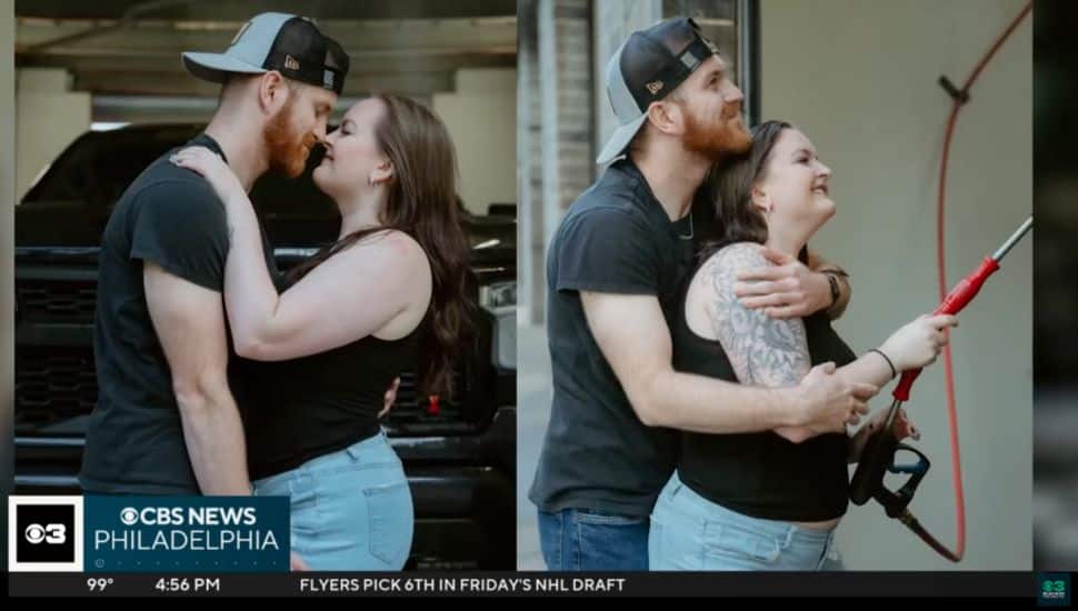 Two strangers pose together.