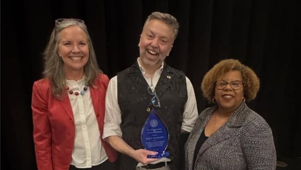 Professor Brent Satterly, center, stands with Widener President Stacey Robertson and Micki Davis, vice president of Inclusion and Belonging.