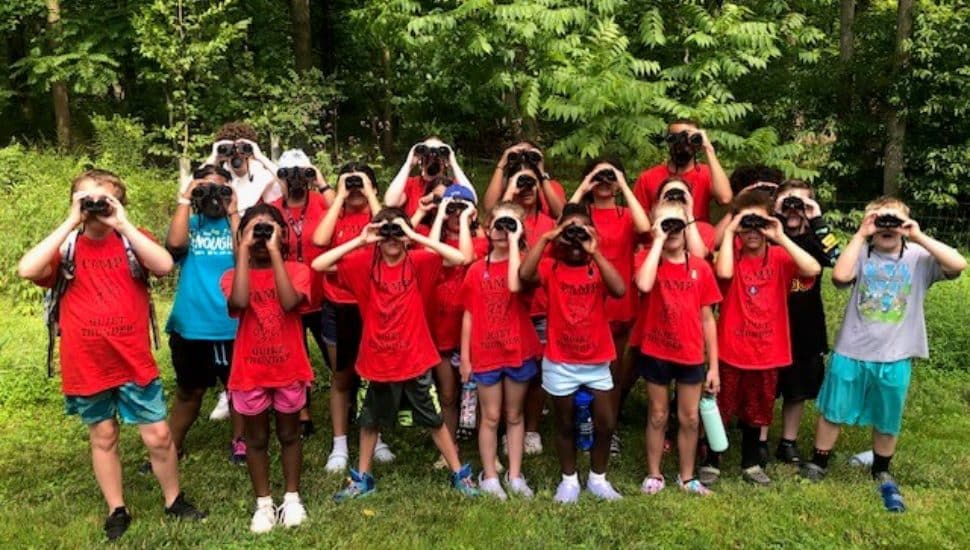 Kids in red shirts at Camp Quiet Thunder.