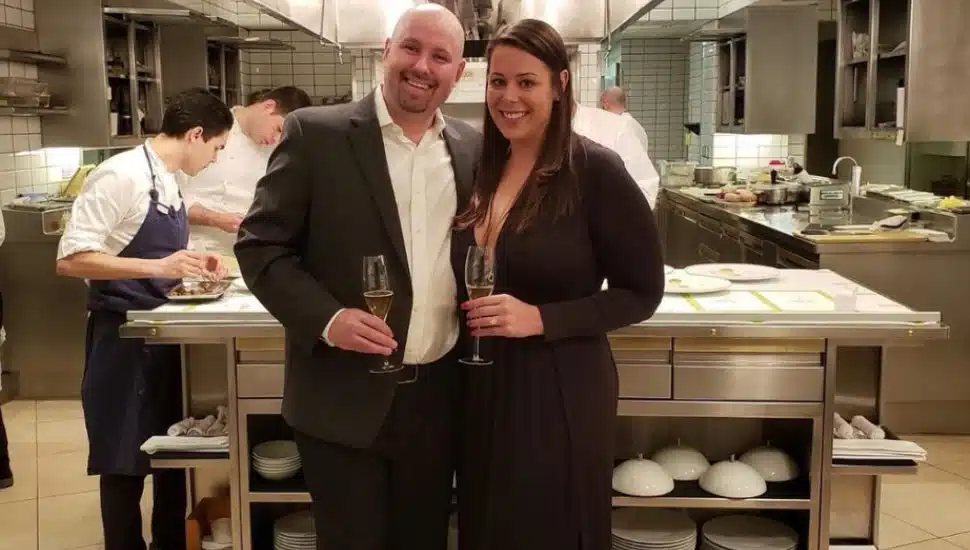 Kate and Philip Ferro smiling in a kitchen.