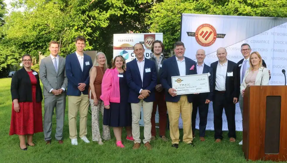 TMACC team with giant check.