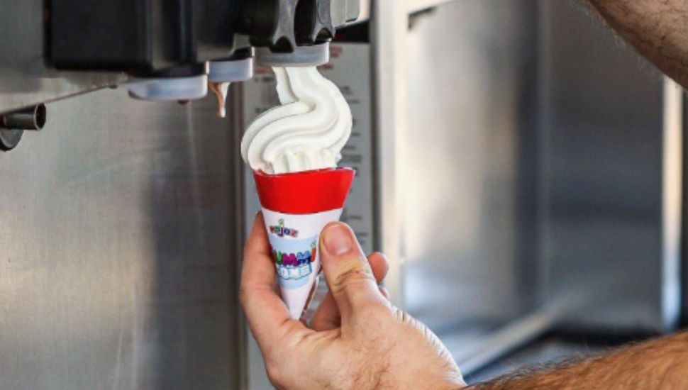 Man holding Gummi Cone to fill with ice cream.