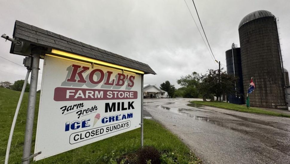 Kolb's Farm Store sign and silo in background.