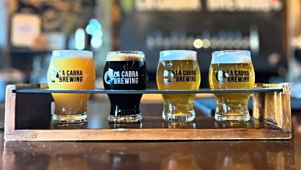 Flight of four beers from La Cabra Brewing.