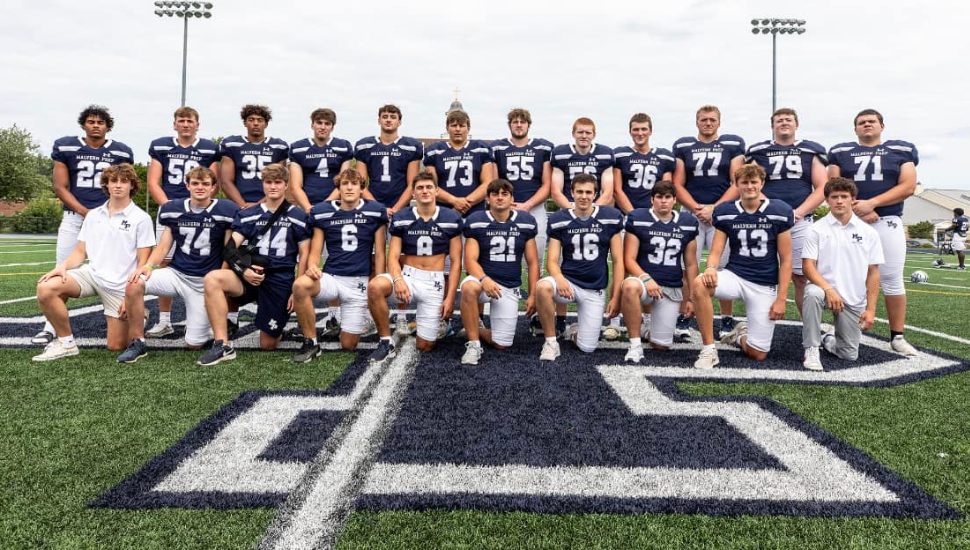 Malvern Prep football team on the field in uniform.