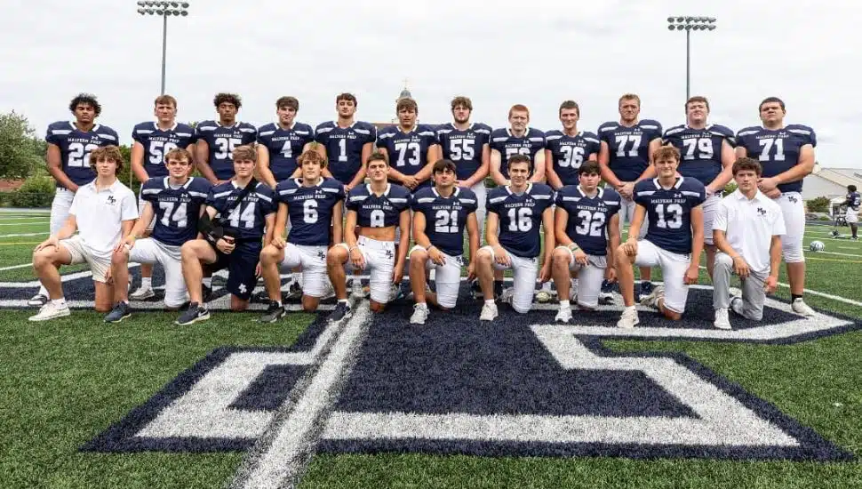 Malvern Prep football team on the field in uniform.