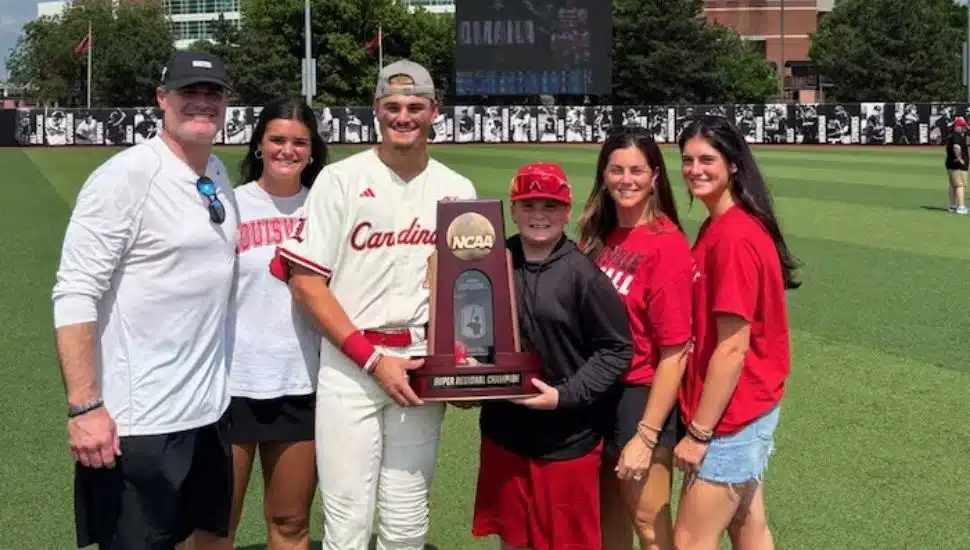 Tague Davis smiling with family after win.