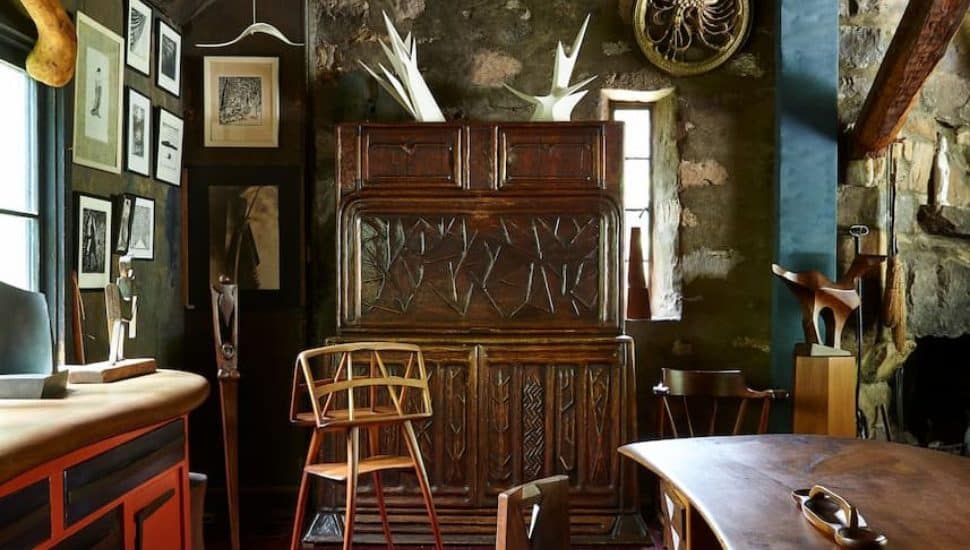 Wooden furniture and art inside Wharton Esherick Museum.