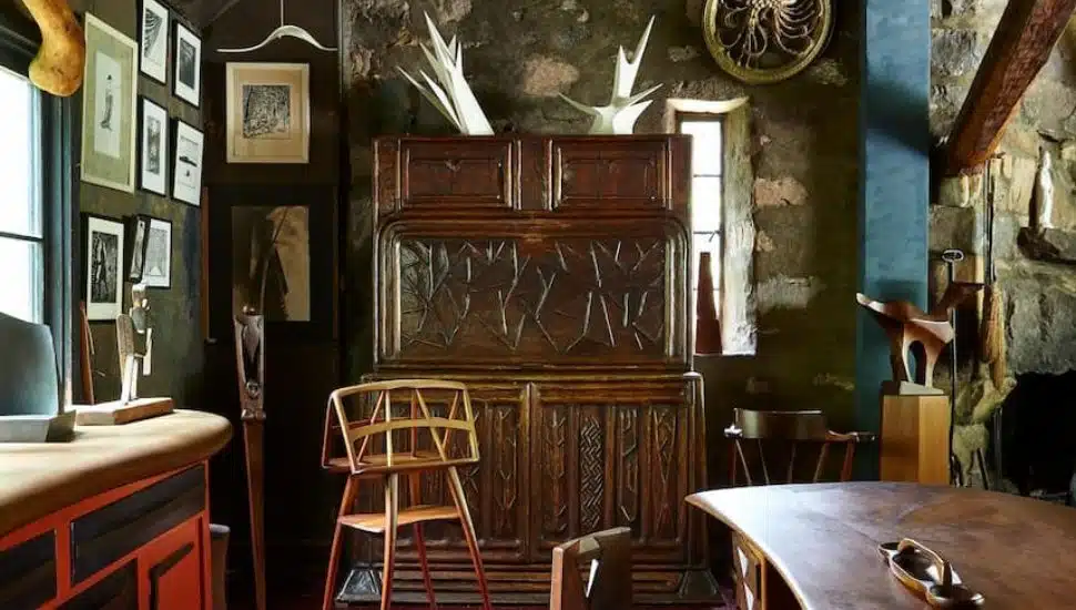 Wooden furniture and art inside Wharton Esherick Museum.