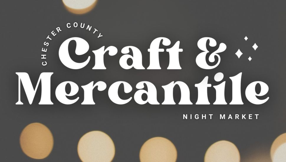 Chester County Craft & Mercantile Night Market logo on a dark background with soft, out-of-focus circular lights. The text is styled in bold white lettering with decorative elements.