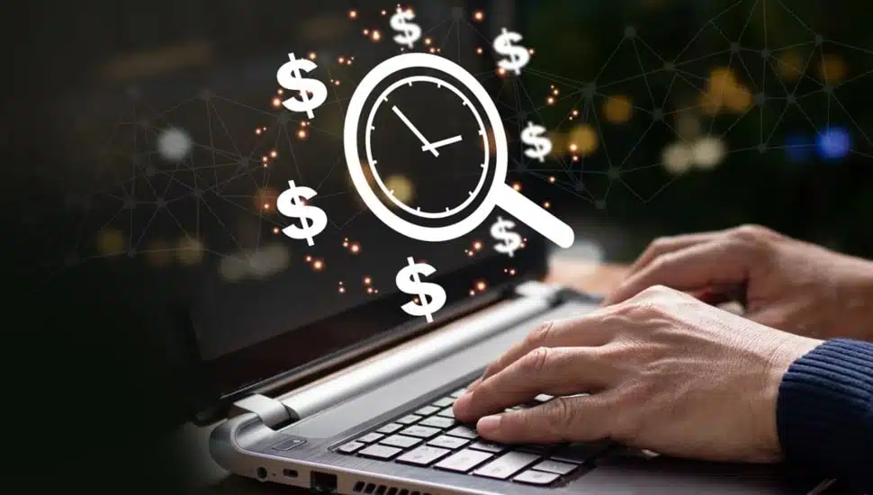 Man works at laptop with graphic of a money-saving clock above.