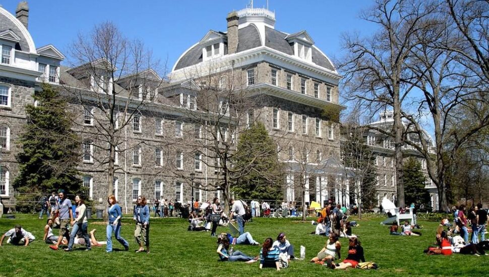 swarthmore college campus with students on the lawn.